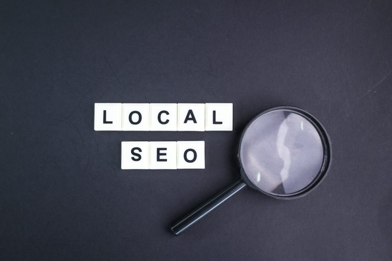 magnifying glass with local seo alphabet words. incredibly effective way to market your near business online